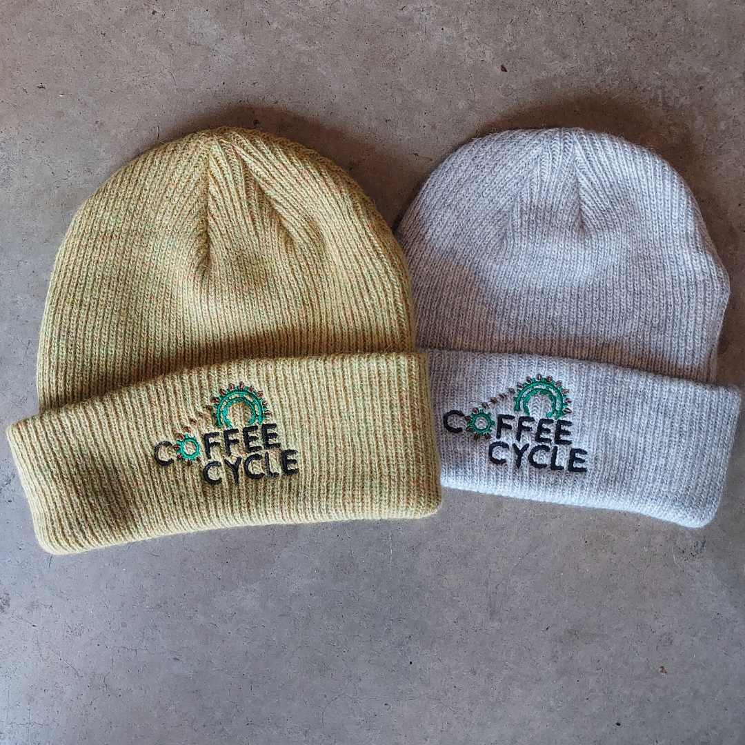Merino wool beanies with the Coffee Cycle Logo embroidered in the front.